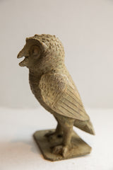 Textured antique bronze base and feet of the handmade African owl sculpture.