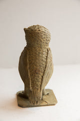 Vintage handmade African owl sculpture, rear view of textured body and carved wings.