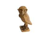 Vintage African owl sculpture with a rustic, handmade texture and large stylized eyes.
