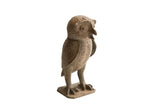 Vintage handmade African owl sculpture with a rough, earthy texture standing on a square base.