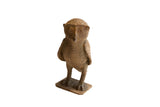 Vintage African owl sculpture with a rustic, handmade texture and earthy brown finish.