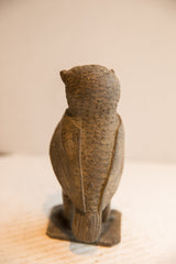 Rear view of a vintage African owl sculpture highlighting its hand-carved wings and tail.
