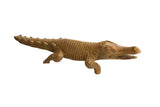Vintage handmade African crocodile sculpture with textured, incised scales and a warm patina.