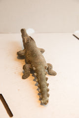 View along the spiny, textured back of the vintage African crocodile sculpture.