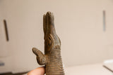 Hand-carved eye, front leg, and textured body of the vintage African crocodile sculpture.