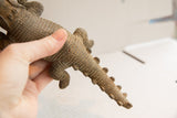 Detailed vintage African crocodile sculpture, highlighting handmade scaled body texture.
