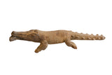 Vintage handmade African crocodile sculpture with carved, textured details and an earthy patina.