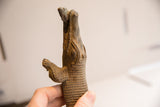 Detailed view of the vintage crocodile sculpture's hand-carved eye and textured body.