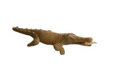 Vintage handmade African crocodile sculpture with a fish in its mouth.