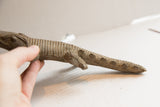 Hand-carved scales and incised line texture on the body of the vintage crocodile sculpture.