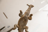 Underside view of the vintage crocodile sculpture, highlighting its form and aged patina.