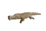 Collectible vintage African crocodile sculpture with hand-carved linear textures and a dark finish.