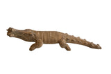 Vintage African Crocodile with Fish Sculpture featuring a hand-carved, textured body.