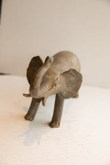 High-angle view of the vintage elephant sculpture showing its expressive face.