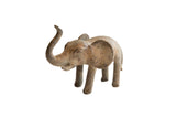 Vintage handmade African elephant sculpture with a weathered brown patina and raised trunk.