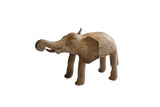 Vintage African elephant sculpture with a rustic brown finish and raised, curled trunk.
