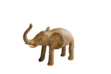 Vintage handmade African elephant sculpture with a rustic, earthy patina and raised trunk.