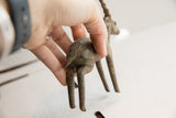 Aged patina on the hand-formed rear of a vintage African antelope sculpture.