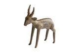 Vintage African antelope sculpture with a weathered, earthy patina and textured spine.