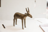 Three-quarter view of the handmade African antelope sculpture with an aged, textured patina.
