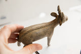 Textured spine detail and aged brassy patina on the vintage antelope figure.