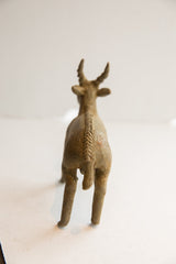 Rear view of the handmade antelope sculpture showing its carved spine and horns.