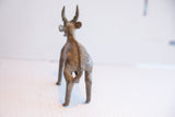 Back view of the vintage antelope sculpture showing the textured detail along its spine.