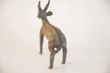 Rear view of the handmade antelope sculpture showing its ridged spine and curled tail.