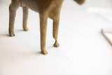 The imperfect hoof and textured legs of the handmade African ram sculpture.