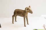 Handmade vintage ram sculpture's rustic profile and textured spine.