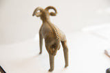 Rear view of the vintage ram sculpture highlighting its textured spine and handmade form.