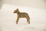 Vintage African ram sculpture in profile, highlighting its aged patina and form.
