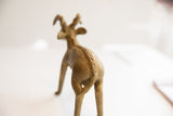 Handmade spine detail and textured surface on the back of a vintage ram sculpture.