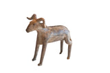 Vintage African ram sculpture with a weathered, earthy brown patina and curled horns.