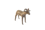 Vintage African ram sculpture with a dark, weathered patina and rustic handmade details.