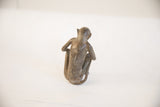 Back view of the handmade African monkey sculpture showing its aged patina.