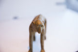 Expressive handmade face of a vintage African monkey showing its textured patina.