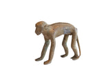 Vintage African Monkey Figurine with a rustic, handmade texture and aged patina.