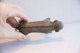 Handmade carved chevron pattern along the back of the vintage African figurine.