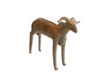 Vintage handmade African ram sculpture with a weathered patina and stylized curved horns.