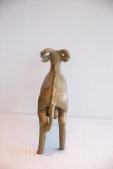Back view of the handmade ram sculpture highlighting its textured spine and tail.