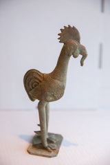 Bronze patina on ribbed neck and head with the rooster's distinctive worm-like beak.