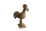 Vintage African rooster with worm sculpture showing its stylized form and textured, aged surface.