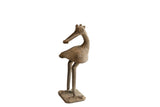 Vintage African bird sculpture with its head turned backwards and a textured body.