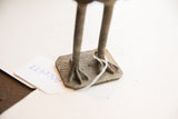 Handmade texture on the sculpted feet and square base of the vintage bird sculpture.