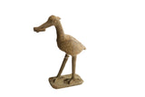 Vintage African bird with fish sculpture showing textured, handmade details and a brown patina.