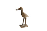 Handmade vintage African bird sculpture, rich in textured detail and dark patina.
