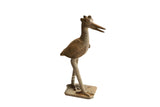 Vintage handmade African bird sculpture with a rustic, textured patina and stylized crest.