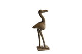 Vintage handmade African bird sculpture with a stylized long neck and rustic patina.