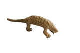 Vintage African pangolin sculpture with a textured, scaled body and rustic earthy patina.